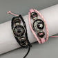 Black sun and pink moon cord bracelets on a display roll showing the sliding knot cord fasteners