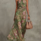 Close up of the green dress fabric texture and the stitched waist seam detail