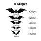Black 3D bat wall stickers grouped densely on a white wall