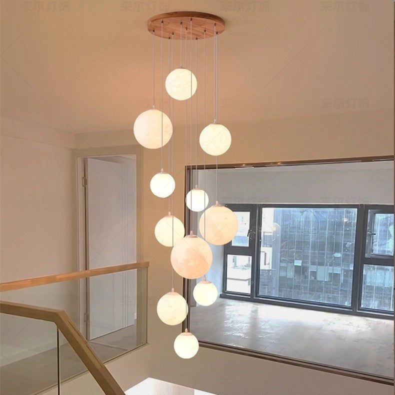 Wood globe pendant chandelier styled in a duplex living room