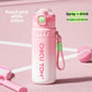 Raspberry pink and white insulated spray water bottle with green latch and a braided carry rope