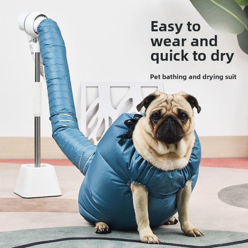 Pug sitting in a blue pet drying bag with a flexible air tube rising to a mounted dryer on a stand