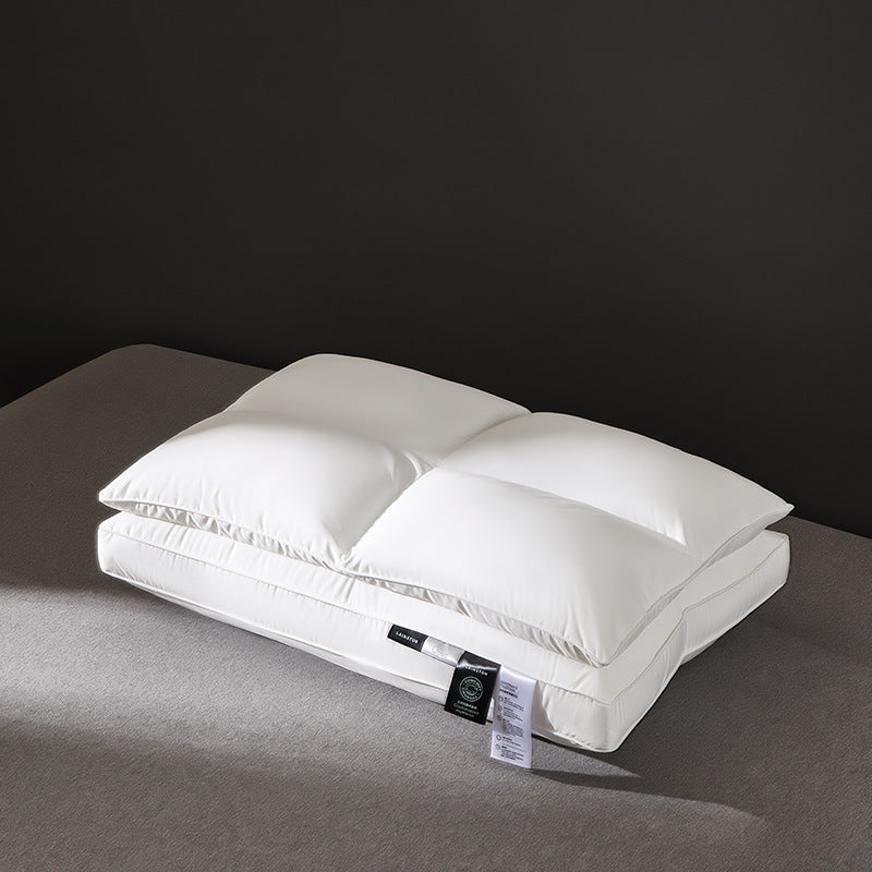 White microfiber bed pillow with a two chamber quilted top on grey bedding