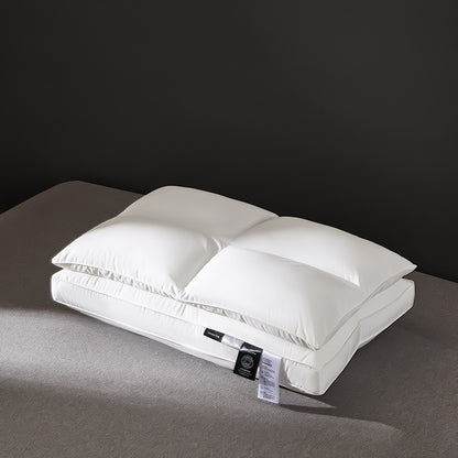 White microfiber bed pillow with a two chamber quilted top on grey bedding