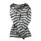 Gray and white striped long sleeve henley top laid flat on a white background with a four button placket