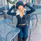 Full length ribbed knit pants worn with the matching top