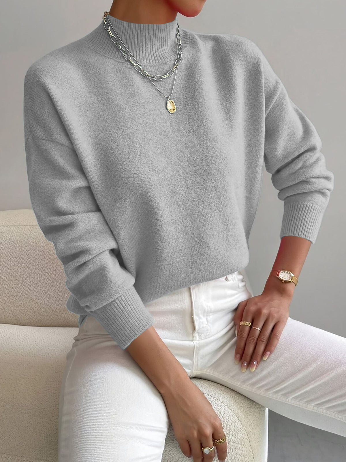Light Gray half-high neck pullover sweater with long sleeves worn with white trousers, size M variant image