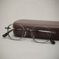 Titanium eyeglasses frame, side profile showing slim temple and spring hinge