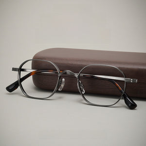 Titanium eyeglasses frame, side profile showing slim temple and spring hinge