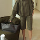 Green zip-up jacket worn zipped up as a light spring layer