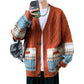 Rust orange cable knit cardigan with a jacquard band on a cut out model, brown buttons and ribbed placket