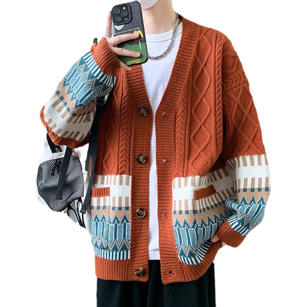 Rust orange cable knit cardigan with a jacquard band on a cut out model, brown buttons and ribbed placket
