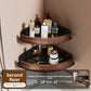 Black walnut fan shaped bathroom corner shelf mounted in a tiled corner with bottles
