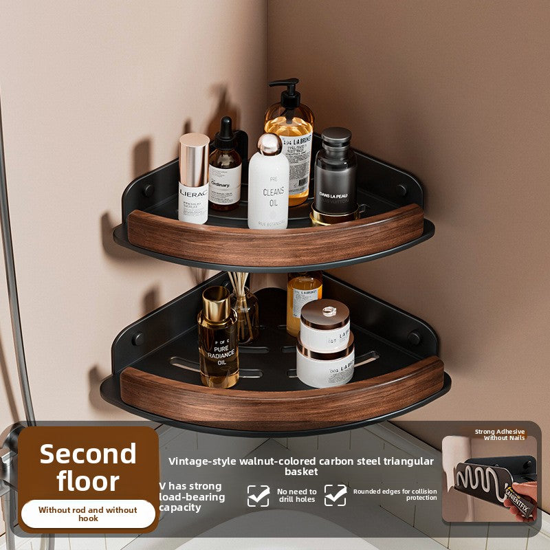 Black walnut fan shaped bathroom corner shelf mounted in a tiled corner with bottles