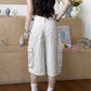 Back view of khaki cargo pants showing two patch pockets and wide cropped leg