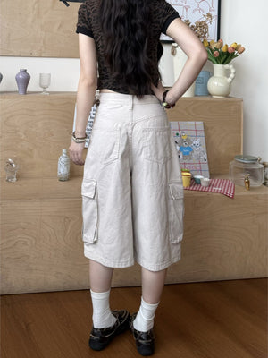 Back view of khaki cargo pants showing two patch pockets and wide cropped leg