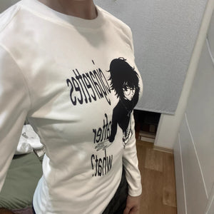 White long sleeve anime graphic tee with a manga print across the chest