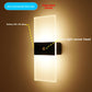 Minimalist LED wall sconce mounted along a corridor wall