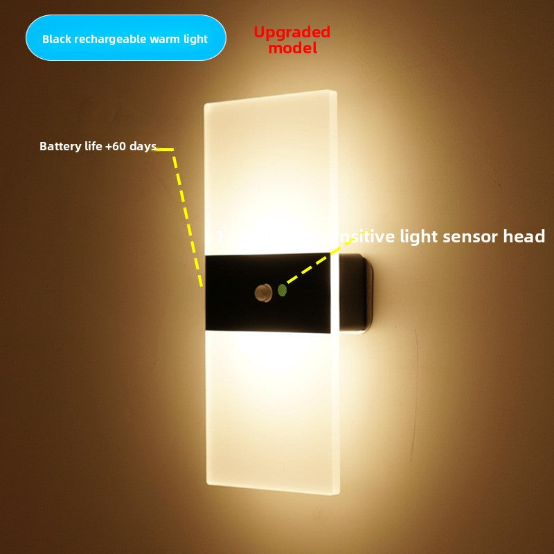 Minimalist LED wall sconce mounted along a corridor wall