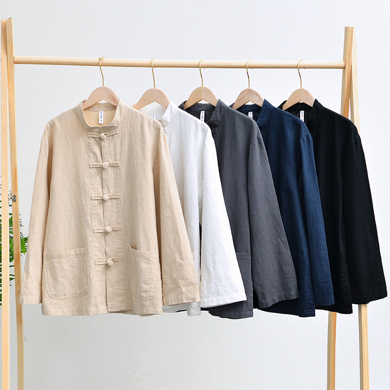 Five shirt jackets in khaki, white, gray, navy blue and black hung on a wooden clothes rail