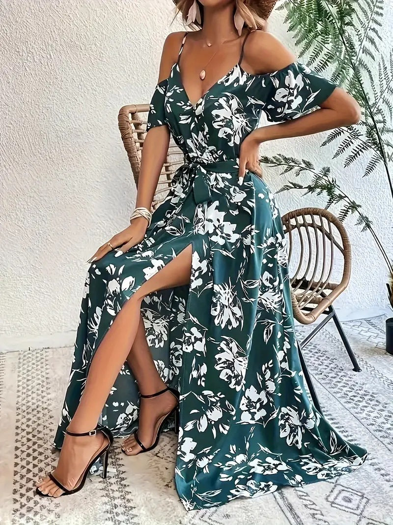 High wrap front slit on the floral maxi dress shown as the model steps forward