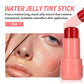 Shade 01 peach coral jelly blush stick beside a face with blush on the cheek and a tint on the lips