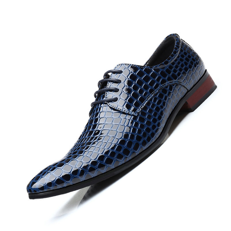 Navy blue crocodile embossed pointed toe derby shoe, three quarter view on a white background
