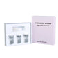 Microneedle serum kit, three 5 ml vials and one applicator cap next to its facial version box