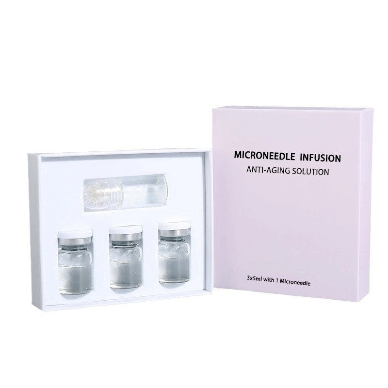 Microneedle serum kit, three 5 ml vials and one applicator cap next to its facial version box