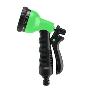 Green spray gun with black expandable garden hose