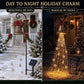 Christmas bell yard light by day on a snowy porch and lit at night with warm cascading strands and a solar panel stake