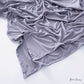 Solid tone modal cotton headscarf wrap laid in soft folds showing the fine jersey knit surface
