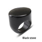 Black stone ring with a flat top face on a white background