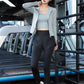 Back view of crossed strap sports bra and seamless leggings