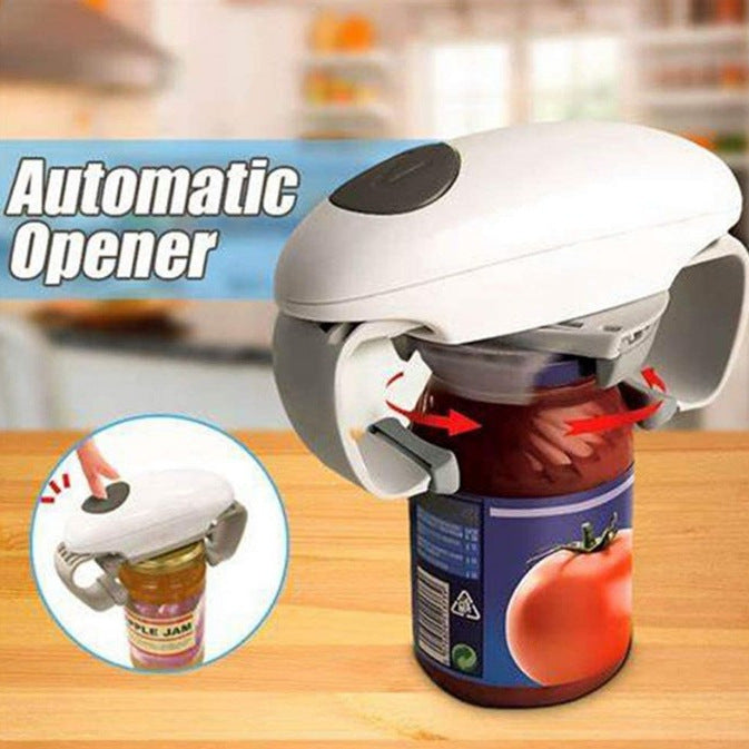 White electric jar opener with a black button clamped on a tomato jar lid, arrows show the arms gripping