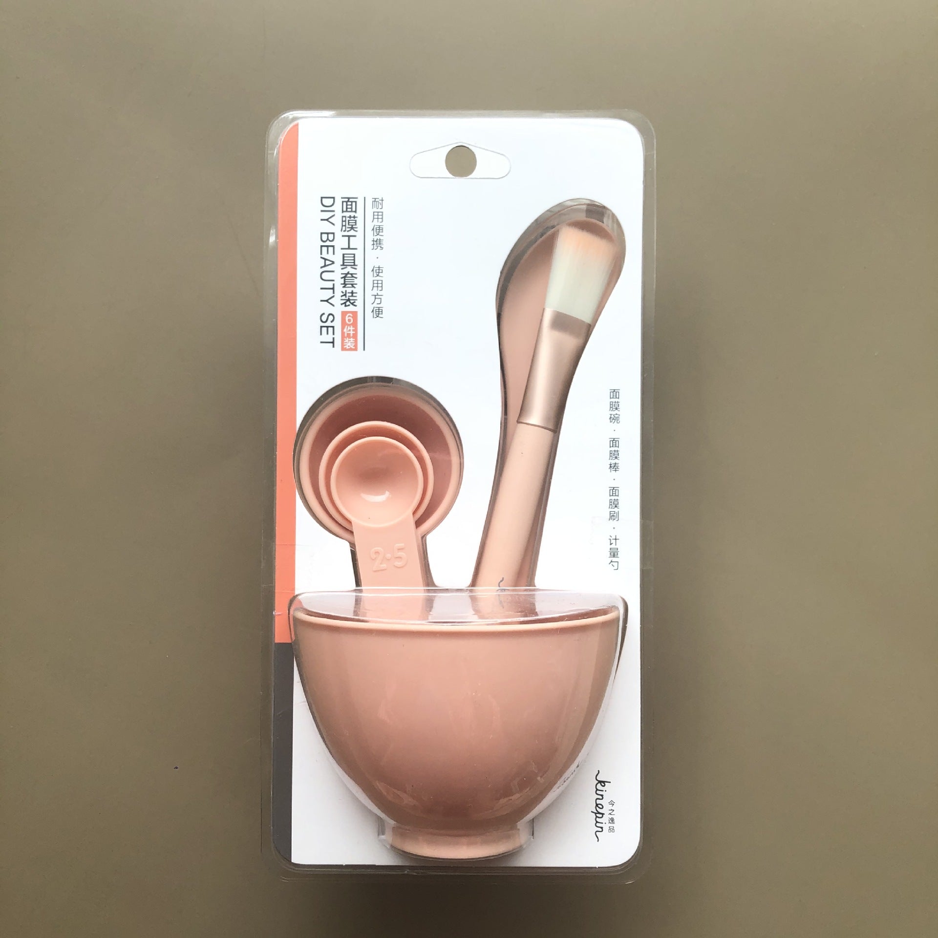 White face mask mixing bowl set with brush spatula and measuring scoop layout