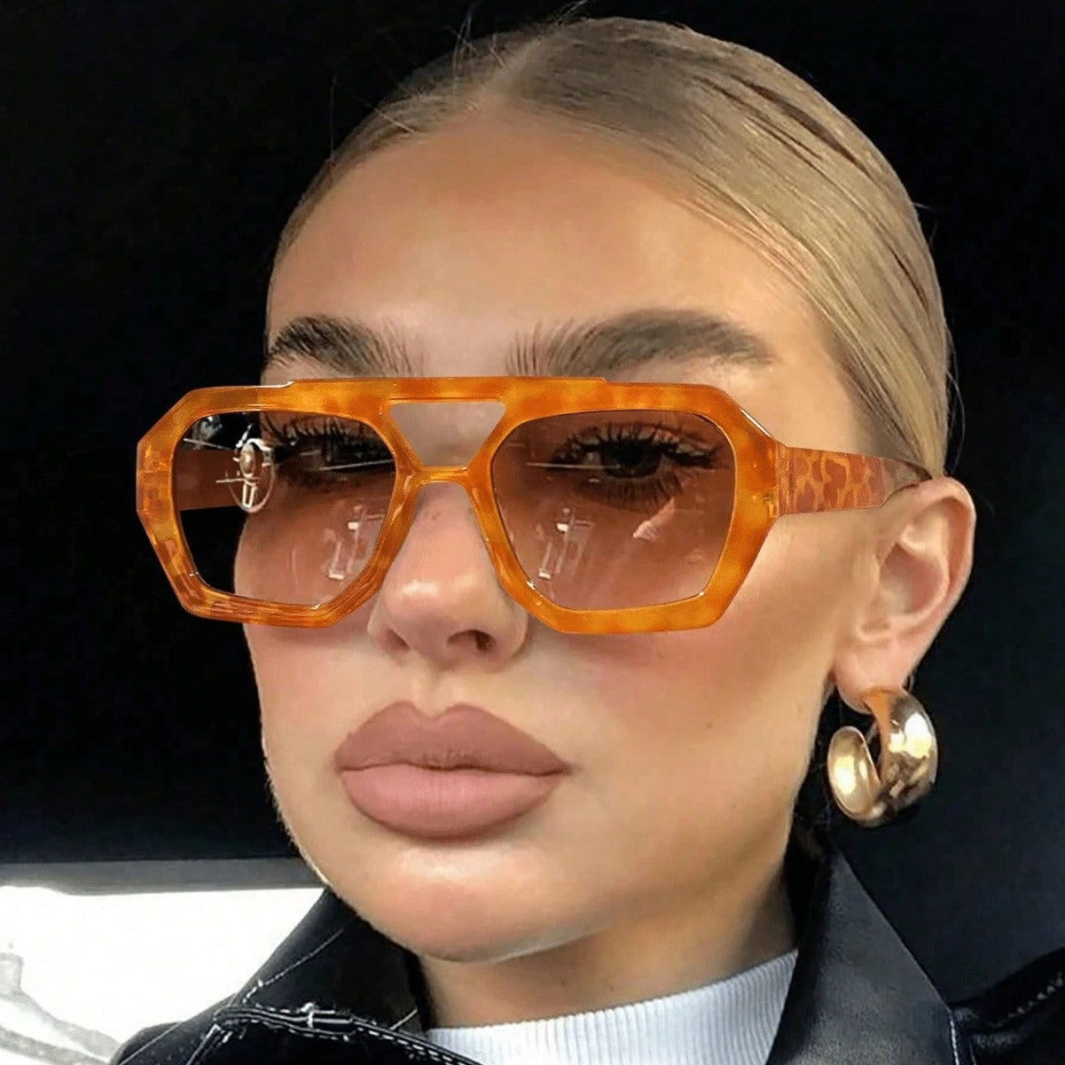 Side profile of polygonal sunglasses showing molded temple and double bridge