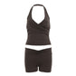 Halter neck top and high-waist shorts set in a soft stretch knit worn by a model