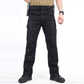 Black tactical cargo pants front view with belt, side zip pockets and angled hip pockets