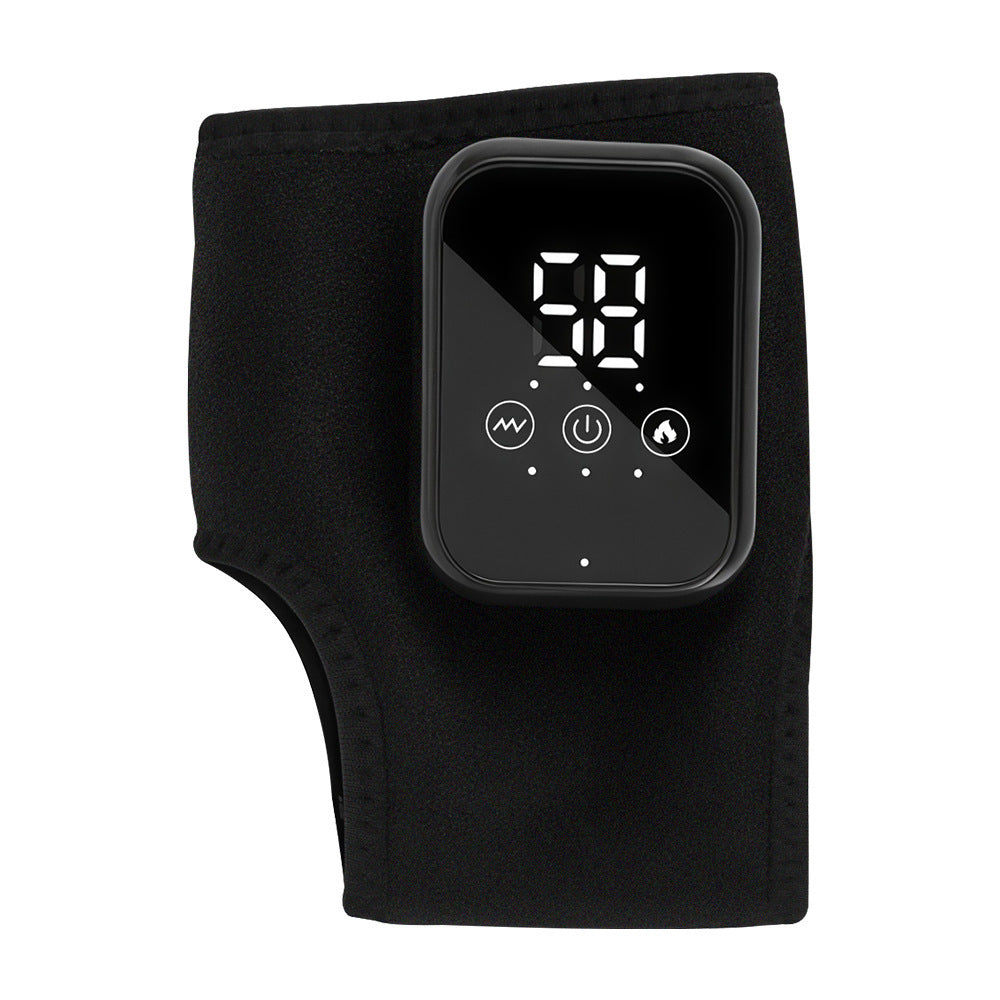 Black fabric ankle heating wrap laid flat with its LED display control pod
