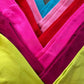 Folded leggings in bright shades, showing the knitted leg with no side seam