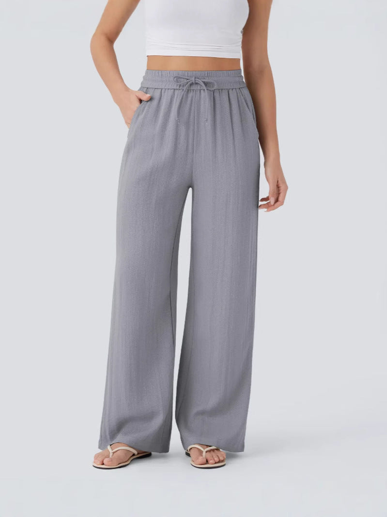 Linen yoga pants shown in use during a gentle stretch