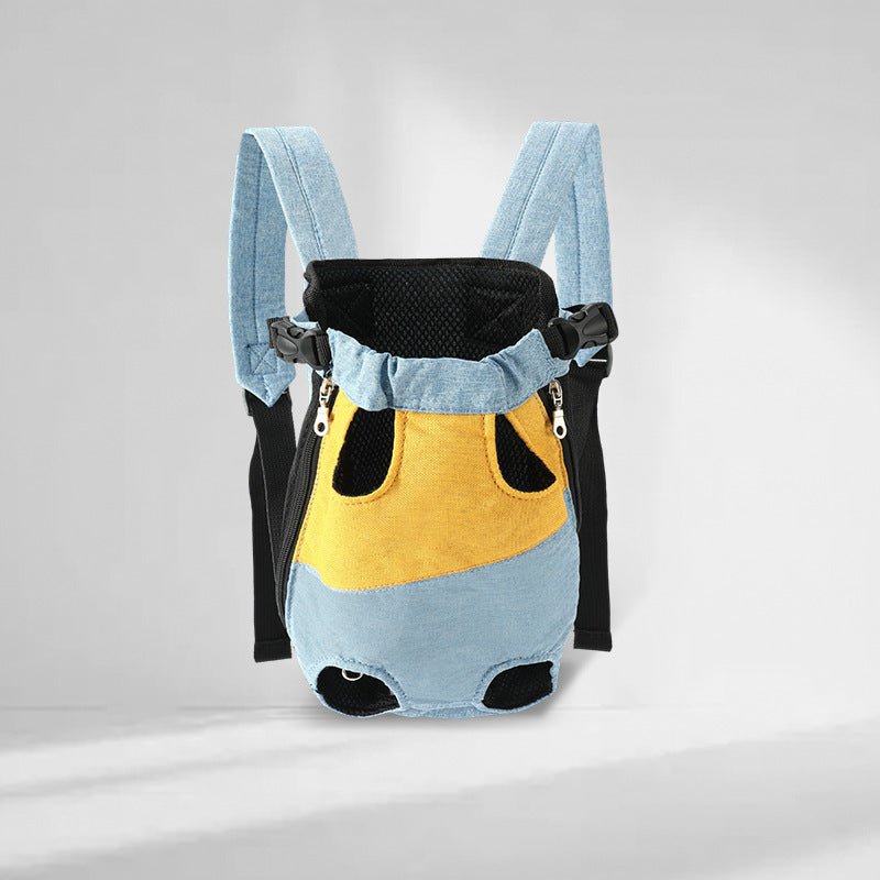Light denim blue and yellow legs out pet carrier backpack on a pale studio backdrop