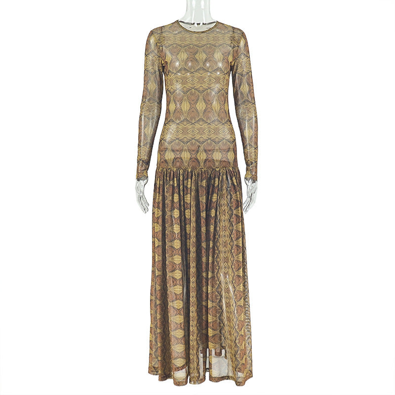 Close view of the amber and brown geometric diamond print on the fine mesh dress fabric
