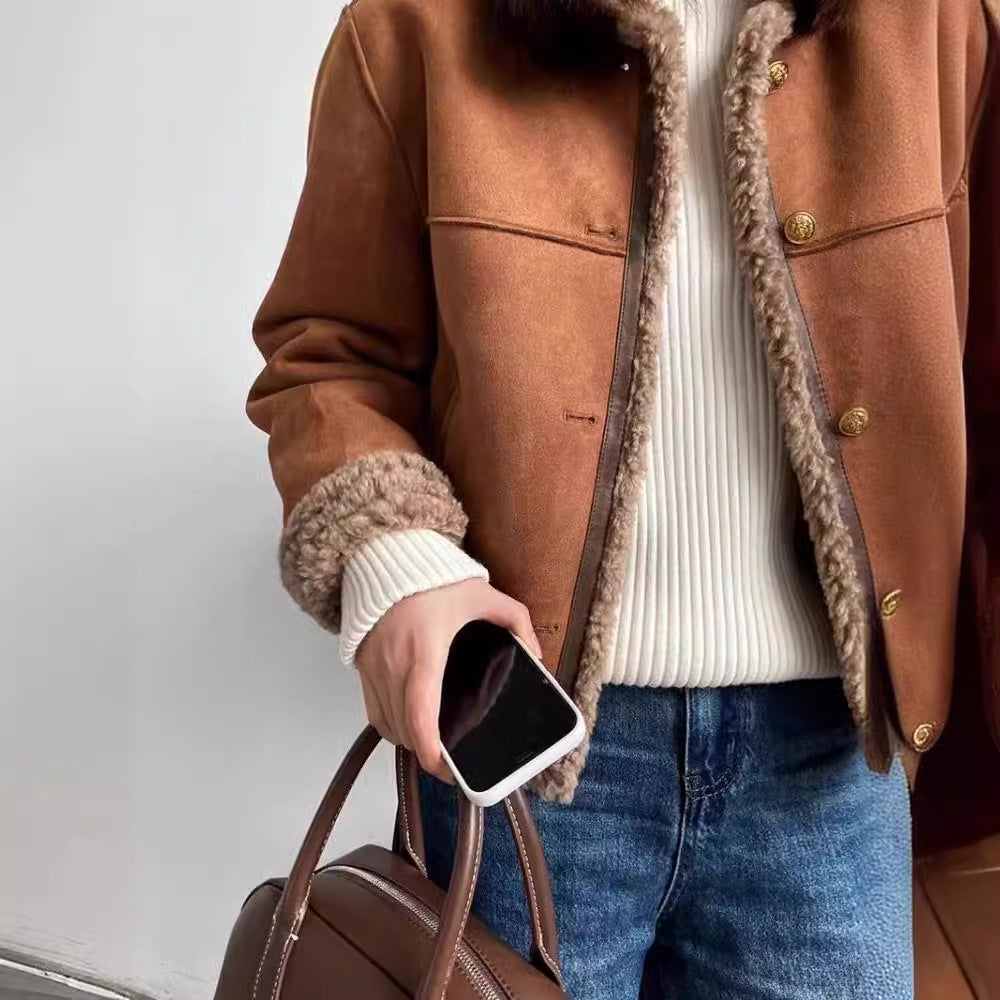 Close-up of plush lamb-style faux fur texture on brown jacket