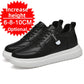 Pair of black low-top sneakers with a Fashion tag strap and a chunky white sole on a white background