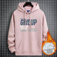 Pink fleece-lined hooded sweatshirt with a NEVER GIVE UP graphic and front pocket, size 2XL option