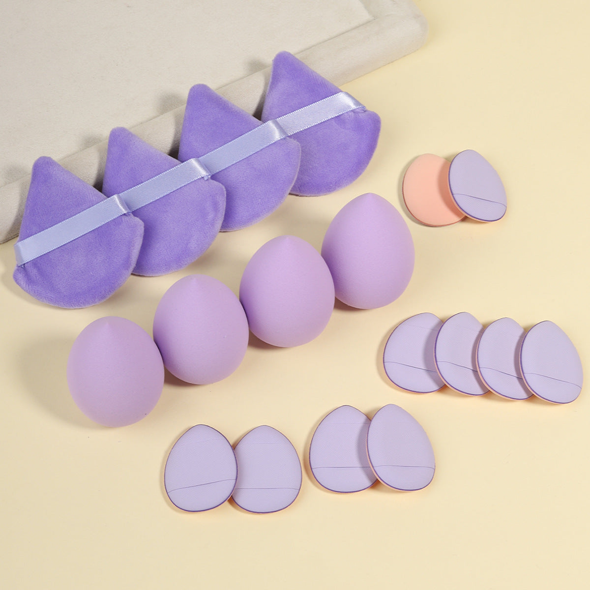 Full boxed set with foam sponges, velvet puffs, a spa headband and a facial cleansing brush
