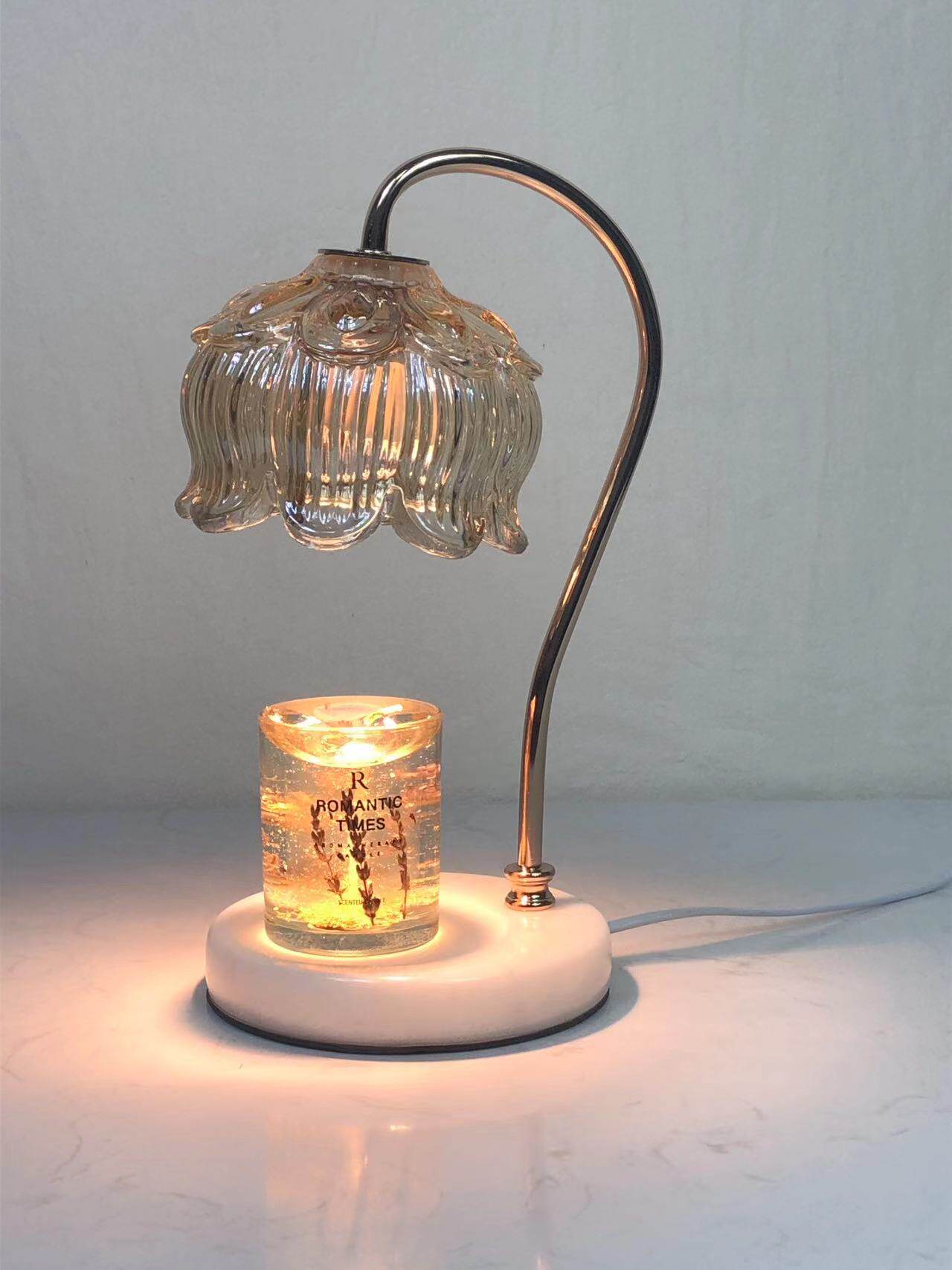 Frosted glass lily shade glowing on a marble base lamp