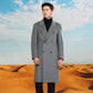Man in a gray double breasted long coat in front of desert dunes, option photo for M | US 38 / EU 48